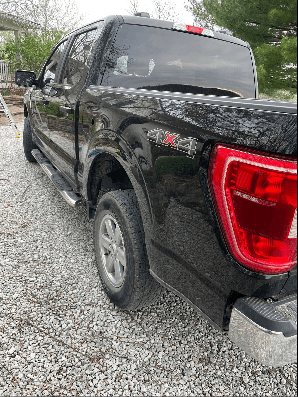 Black Ford F-150 detailed in a driveway in the KC metro
